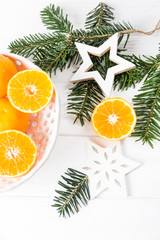 Fototapeta na wymiar Tangerines and Christmas decorations