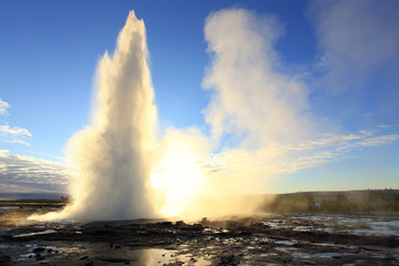 Strokkur Geysir Eruption against the Sun, Iceland