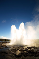 Strokkur Geysir Eruption against the Sun, Iceland