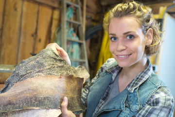 Woman holding fish skins
