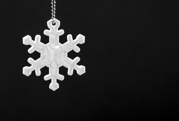 Black and white photo of safety reflector in the form of snowflakes. Necessary equipment to...