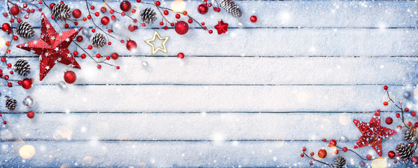 Christmas Ornament On Wooden Background With Snowflakes

