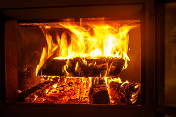 Firewood burning in the fireplace. Seen only the flames covering