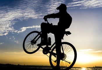 Obraz na płótnie Canvas Silhouettes Of Biker