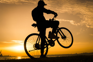 Fototapeta na wymiar Silhouettes Of Biker