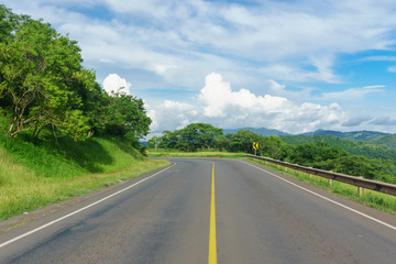 road view with beautiful sky in green mountain, road trip travel concept