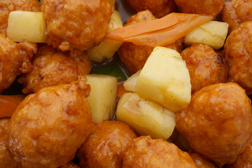Chinese food. Sweet and sour meatballs with pineapple