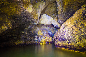 Fototapeta premium Underground river in flooded cave Head of Otap, Abkhazia, Georgia