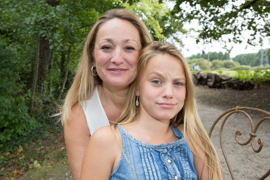 Portrait Of Mother And Her Teenage Daughter Outdoor In Nature