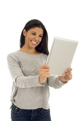 young happy and excited hispanic woman holding digital tablet pad smiling isolated on white