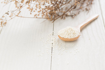 white sesame seeds on wooden spoon,Healthy Food White on the woo
