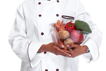 Chef hands with vegetables.