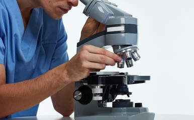 Doctor man with microscope.
