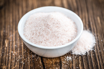 Wooden table with Pink Salt (selective focus)