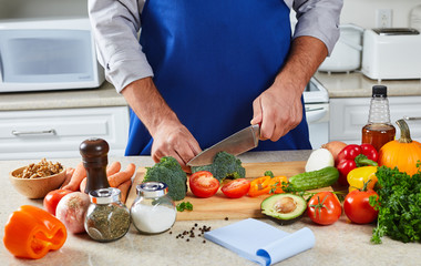 Obraz na płótnie Canvas Chef man cooking in the kitchen.