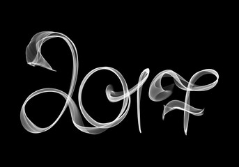 2017 isolated numbers written with white smoke or flame light on black background