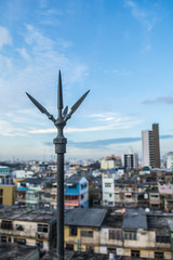 Black lightning rod with cityscape background.