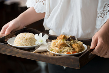 Chef serving brown rice and vegetarian food.Healthy food menu ,delicious and good for  health