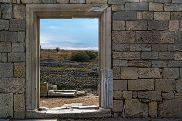 Naklejka premium Window in the wall of the destroyed building