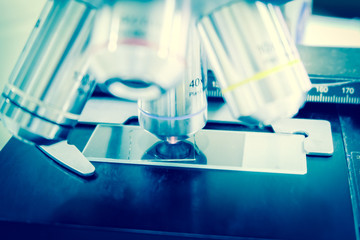 Laboratory Microscope. Scientific research blue background.