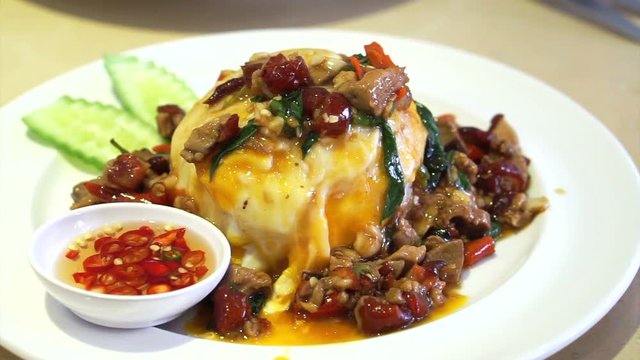 Thai local everyday food, Spicy pork basil stir fries with fried egg over rice