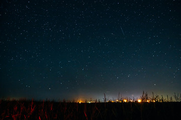 A shooting star in the starry sky