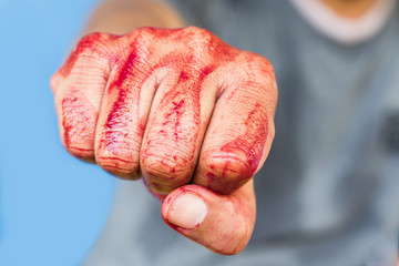 Bloody theme lone murderer: the murderer shows bloody hands and