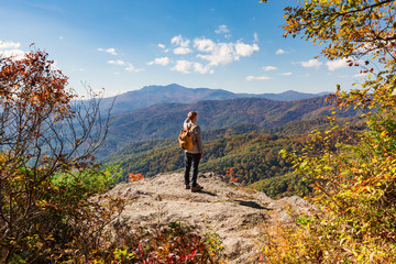 Man walking on the edge of a cliff