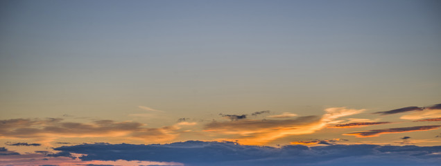 The sky is painted in bright red shades.