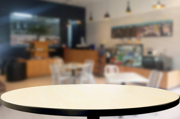 Selected focus empty brown wooden table and Coffee shop or restu