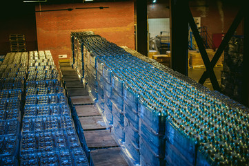 Interior warehouse. pallets with bottles stand in rows stock