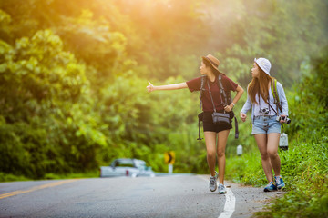 Obraz premium The tourist asian women travel in the middle of nature the car w