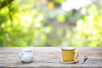 white vintage teapot with yellow mug