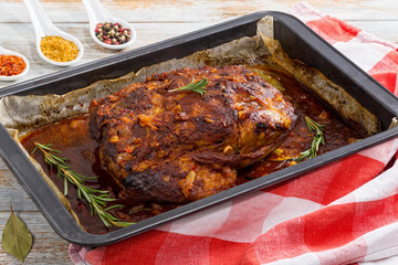 Oven-Barbecued Pork shoulder grilled in roasting pan