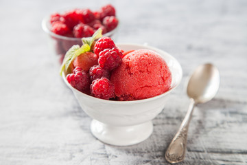 raspberry ice cream with berries, selective focus