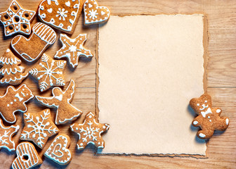 Christmas cookies with paper on wooden table. Merry Christmas and Happy New Years eve! Top view