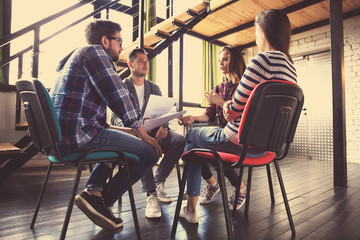 Fototapeta na wymiar Creative business people meeting in circle of chairs.