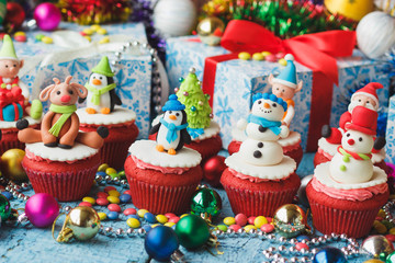 Fototapeta na wymiar Christmas cupcakes with colored decorations