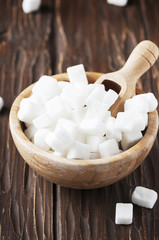 White sugar on the wooden table