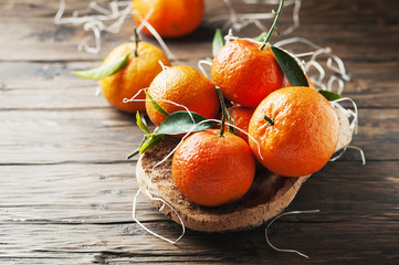 Sweet italian mandarins on the wooden table