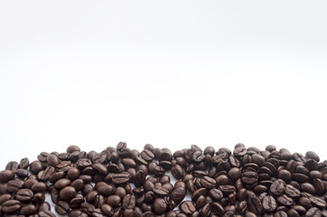 coffee beans on white background. subject soft focus