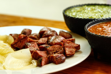 sliced sausage with sauces