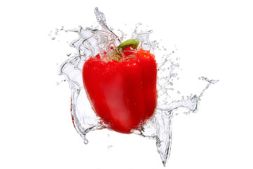 Water splash and vegetables isolated on white backgroud with clipping path. Fresh bell pepper