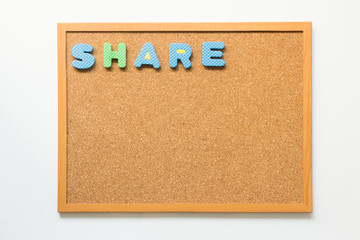 Cork board with wording share on white background