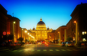 Fototapeta na wymiar road to St. Peter's cathedral in Rome at night with lights, Italy, toned