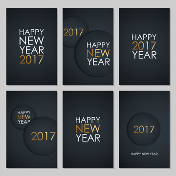 Set of 2017 Happy New Year greeting cards with golden colored elements and black background. Vector illustration.