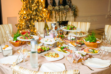 Rich served dinner table prepared for Christmas