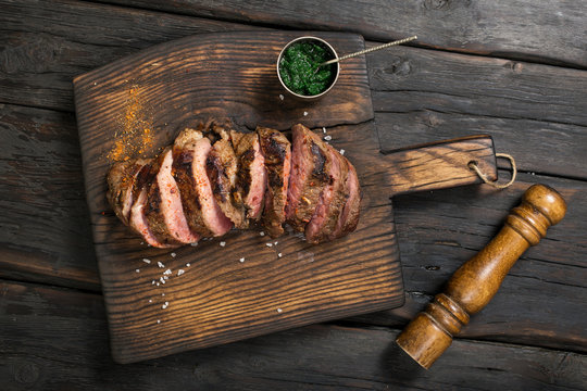 Grilled beef barbecue Striploin steak with chimichurri sauce