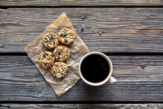 cookies with chocolate and coffee on a wooden background. drink, sweets, breakfast