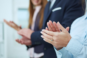 Cropped image of businesspeople clapping.